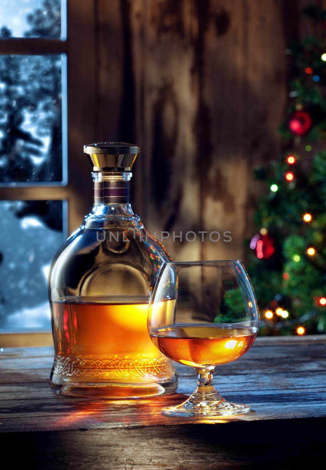 close up view  of two glasses with whiskey on color back
