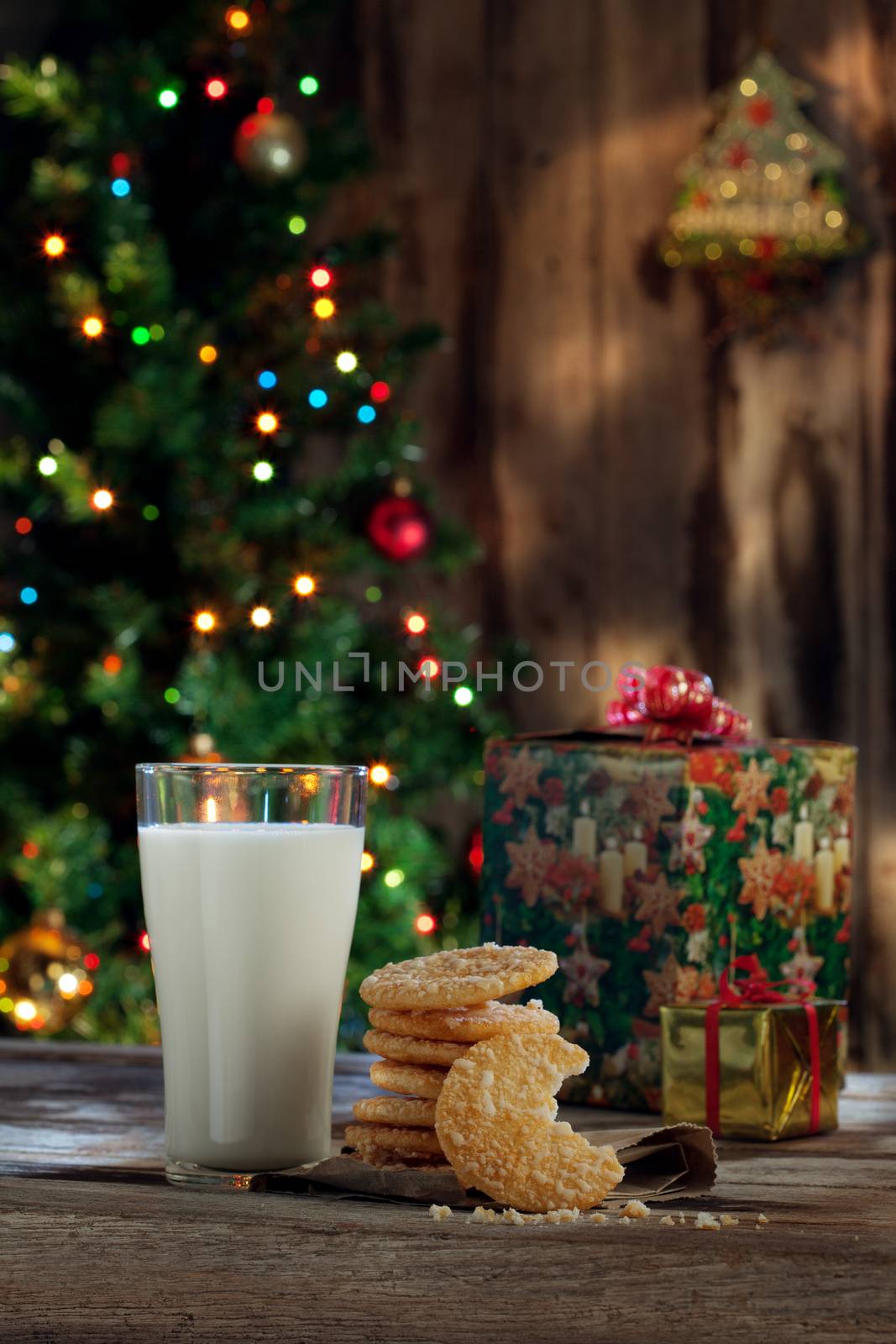 close up view of glass of milk with cookies on color back