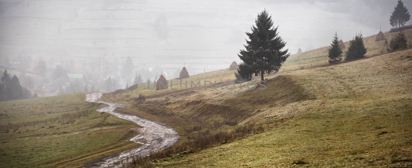 First snow in autumn. Snowfall in mountains. Panorama