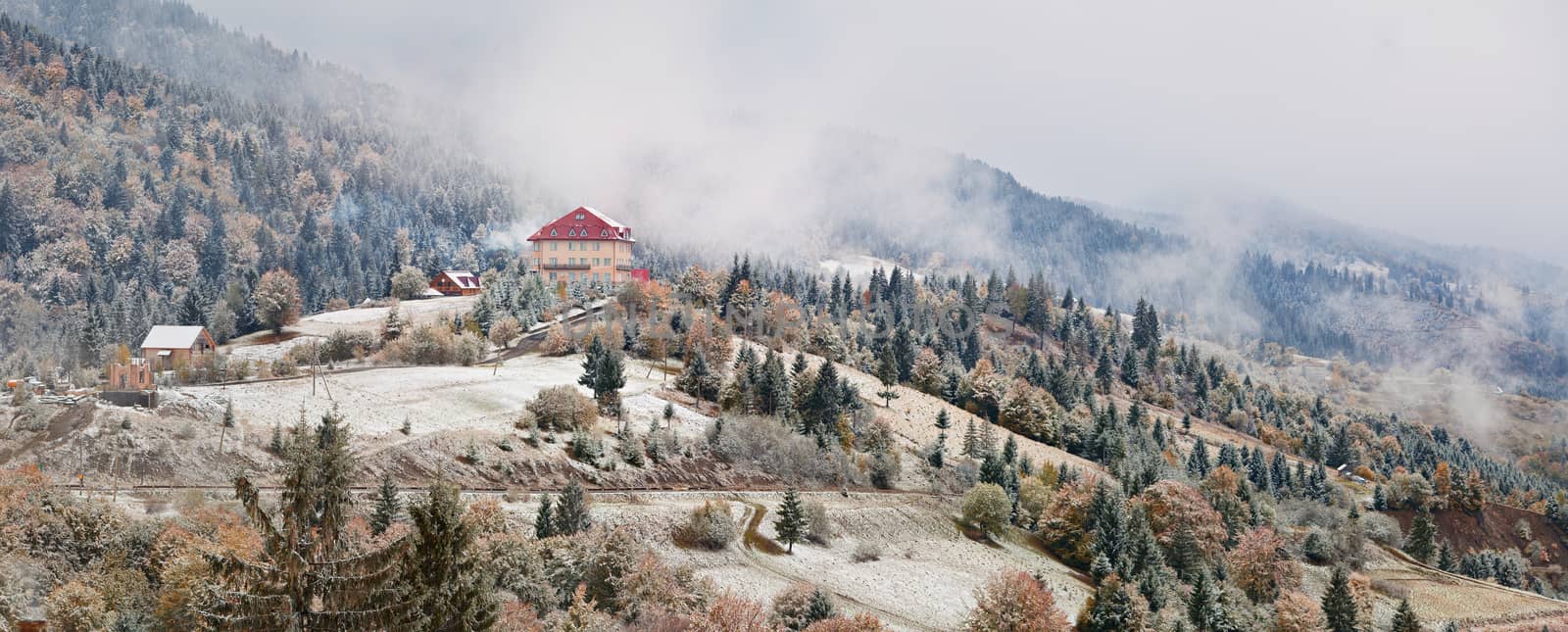 Hotel in mountains. Snow and fog. First snow in autumn.  by weise_maxim