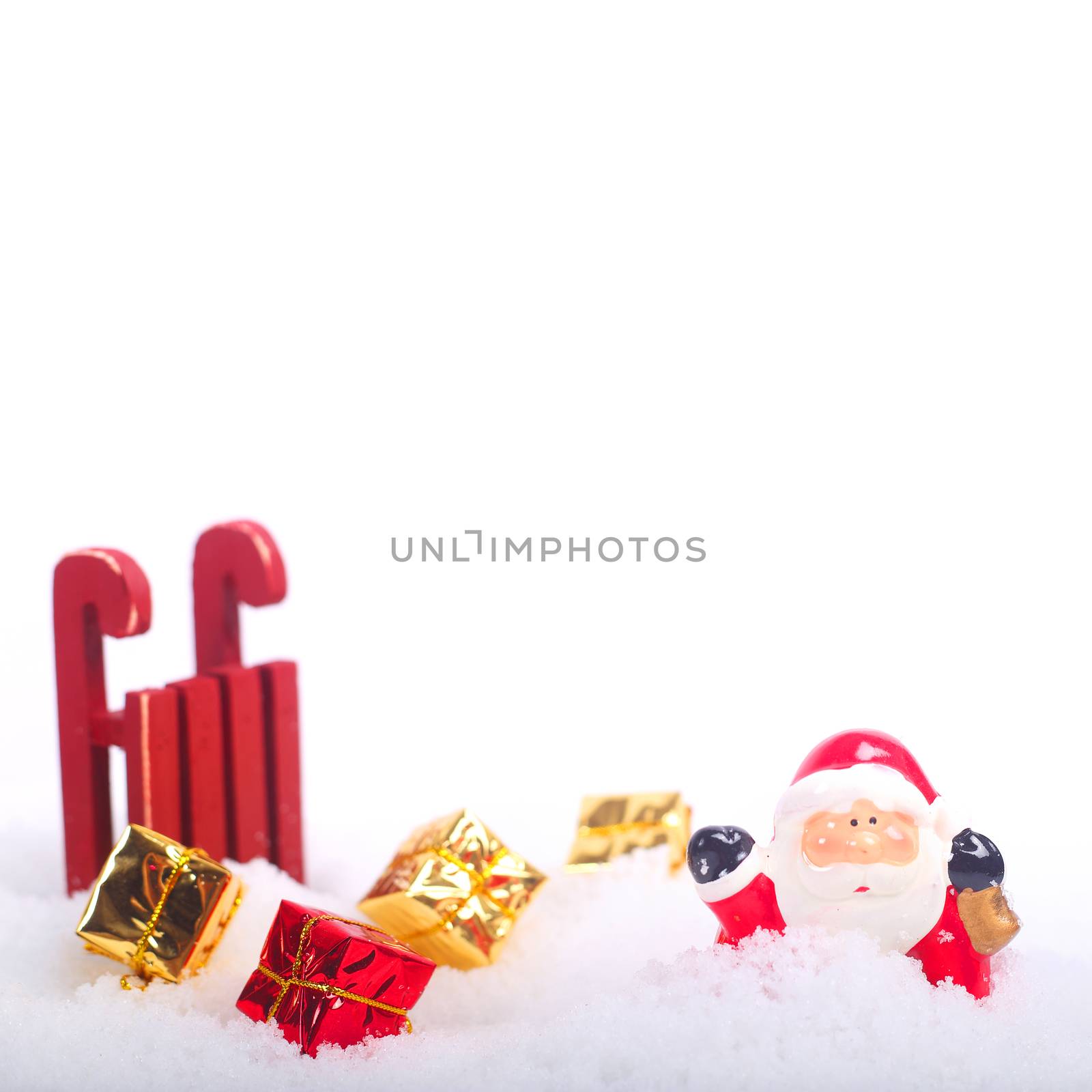 Santa Claus sledge accident in deep snow with gifts around