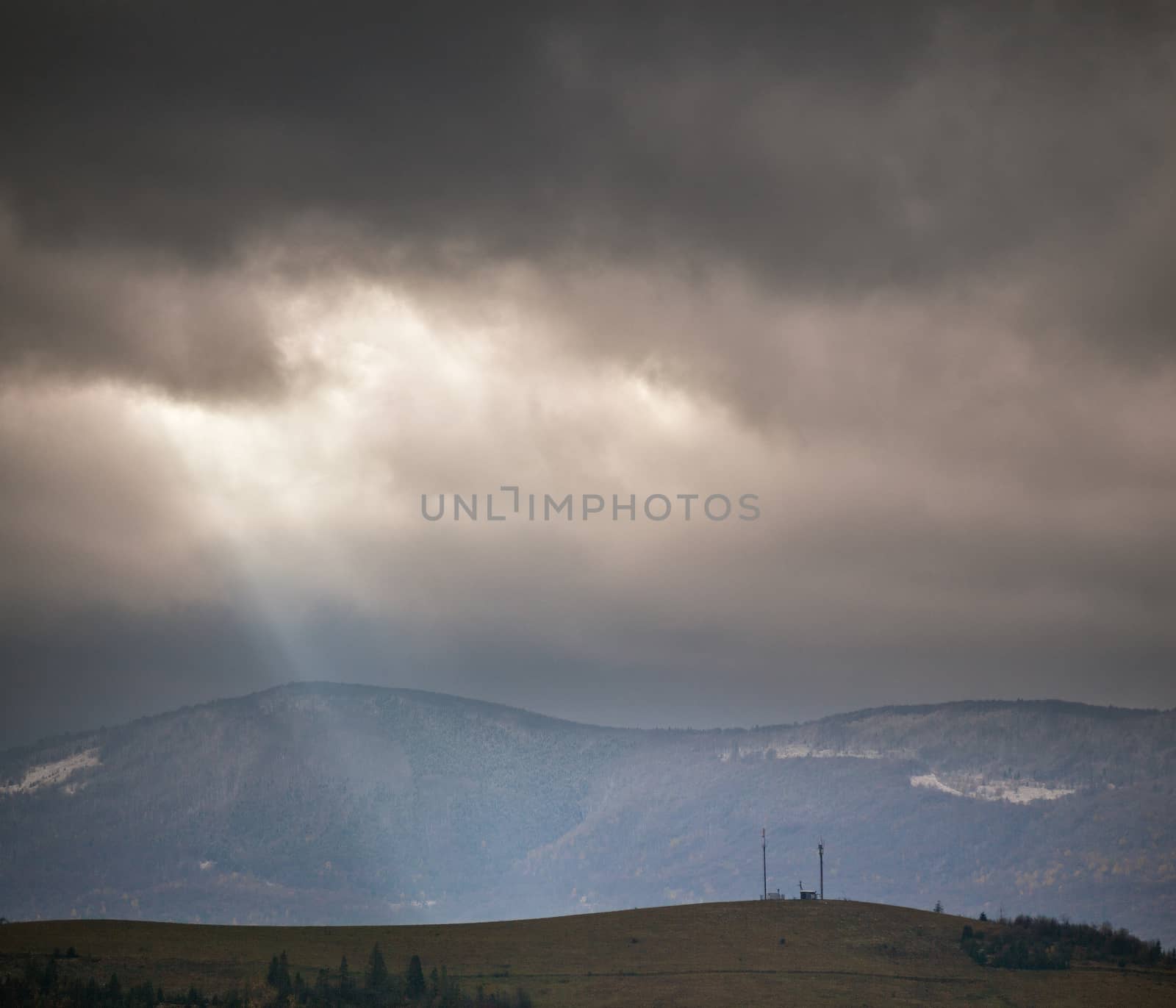 Overcast scene in cloudy mountains. November rain