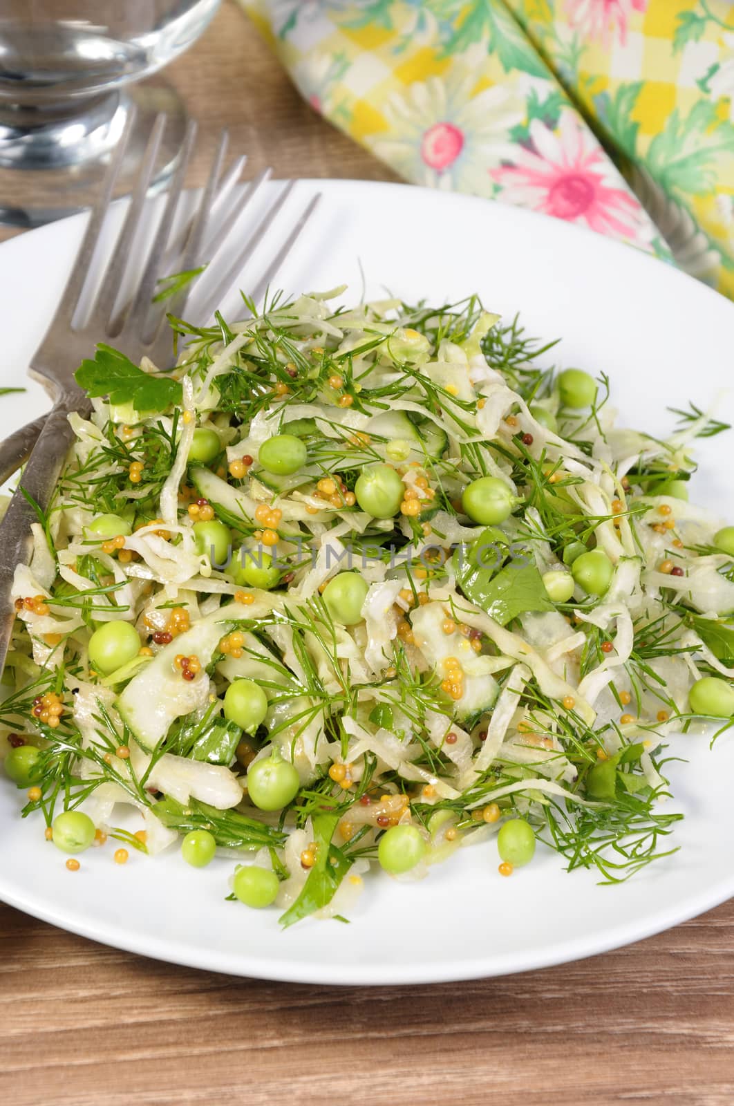 Coleslaw with cucumbers and peas, seasoned with dijon mustard and dill