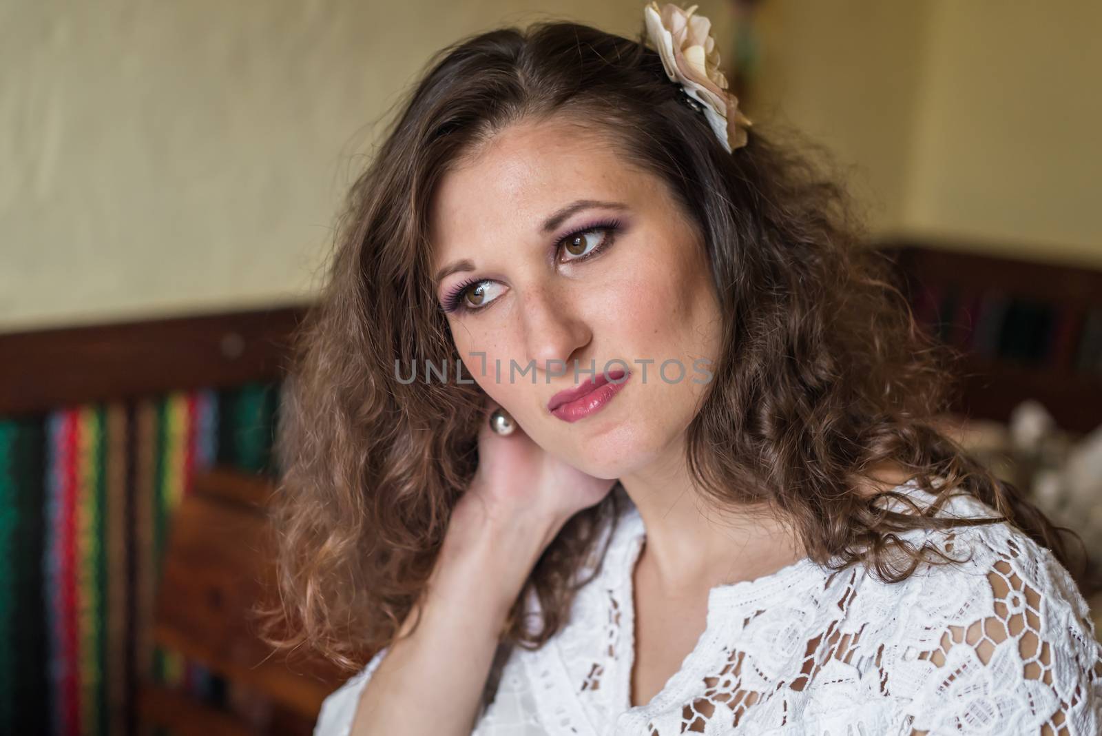 Portrait of a beautiful girl with brown wavy hair