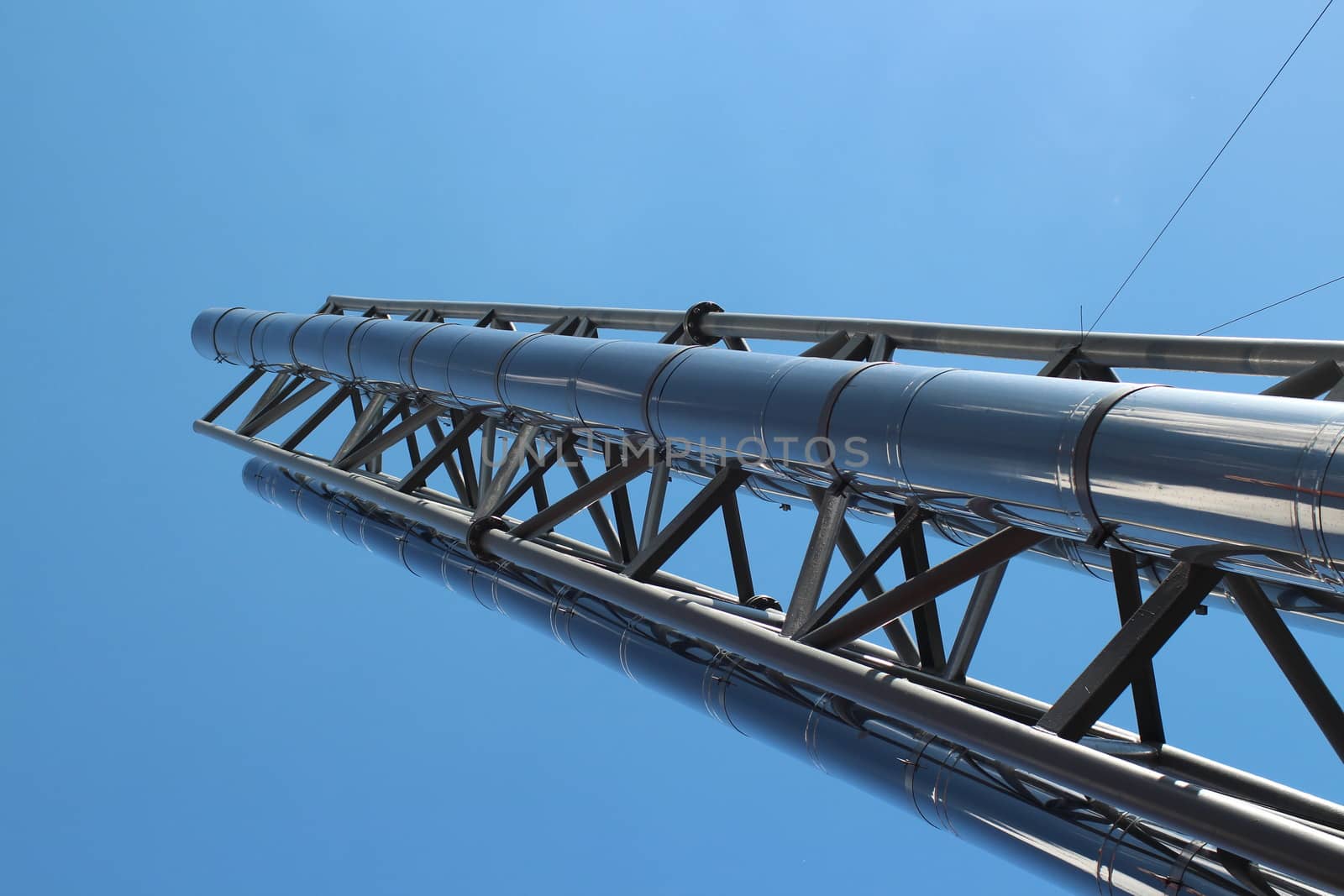 chimney with stainless steel against a background of blue sky