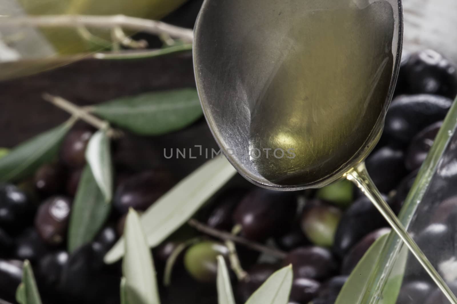 Olive oil and Olive on wood