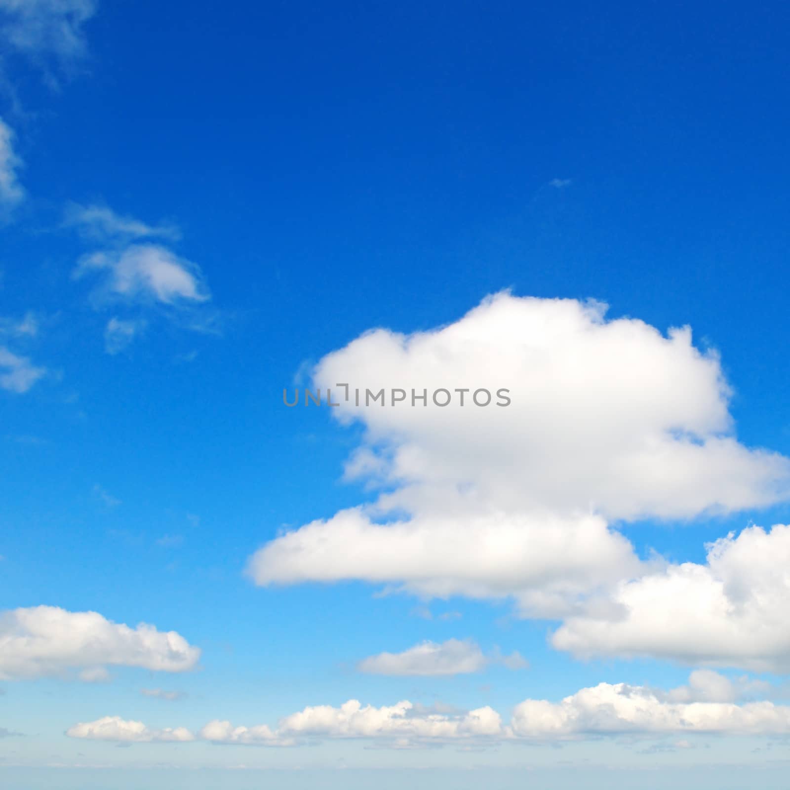                                     fluffy clouds in the blue sky