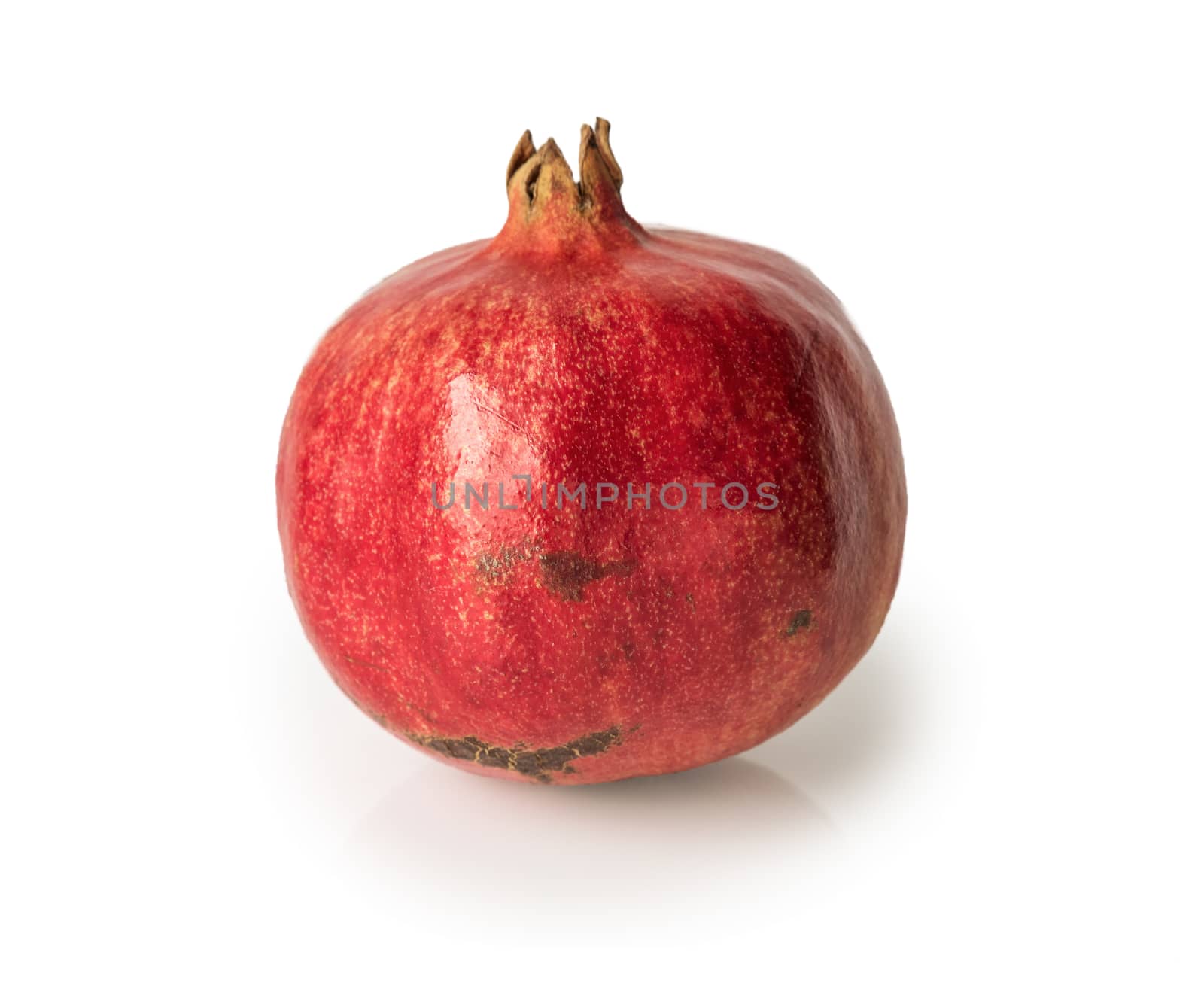 Ripe pomegranate fruit isolated on white background cutout