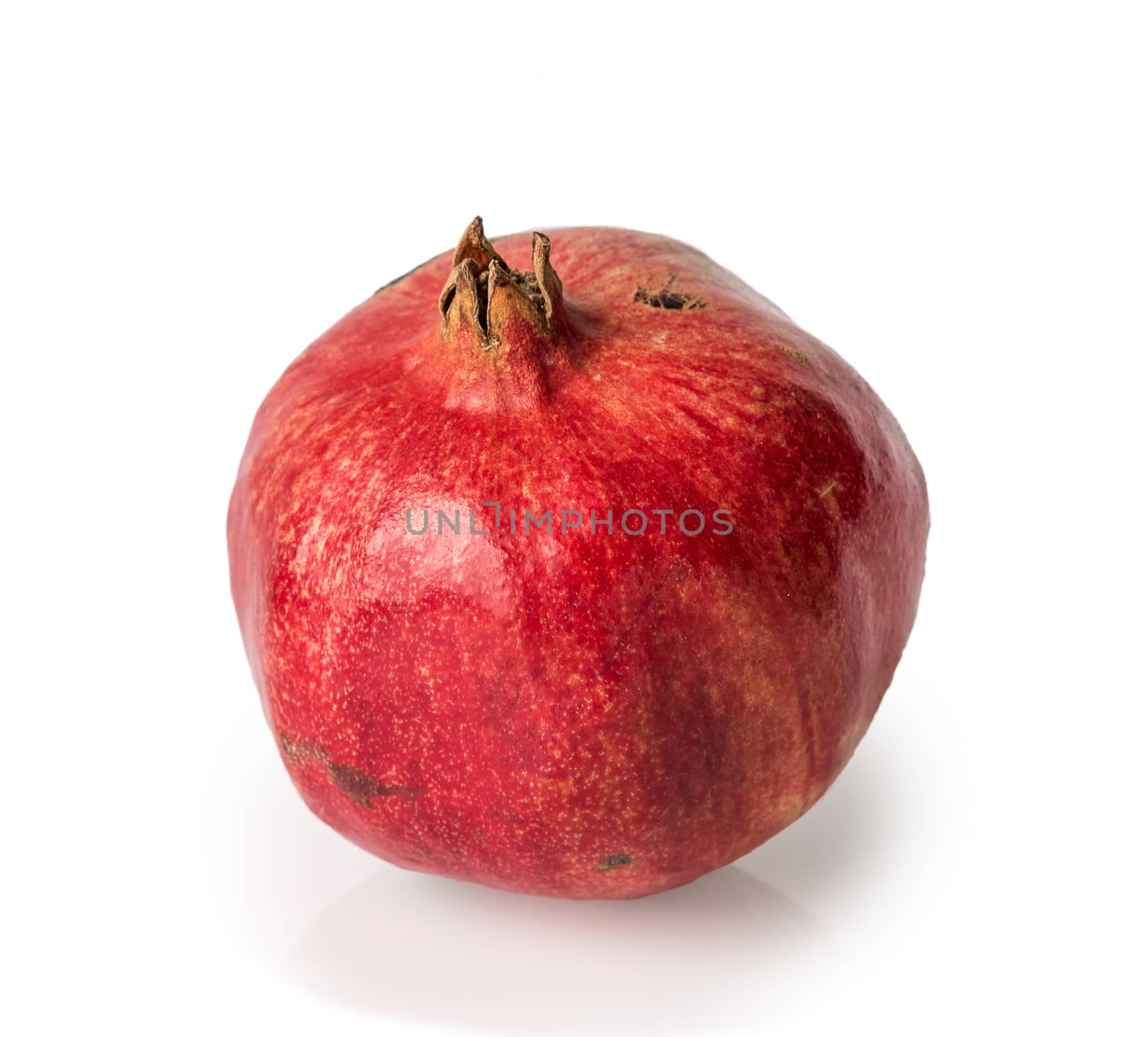 Ripe pomegranate fruit isolated on white background cutout