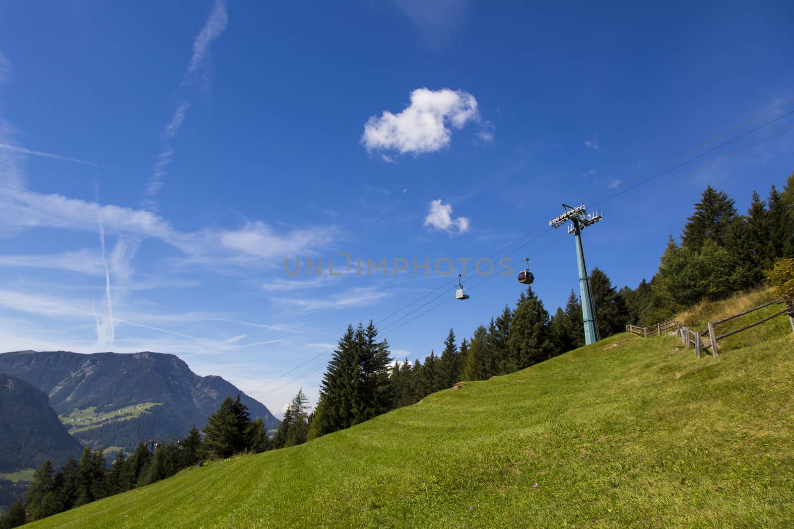 Bottom view of a cableway in a sunny day in Seiser Alm