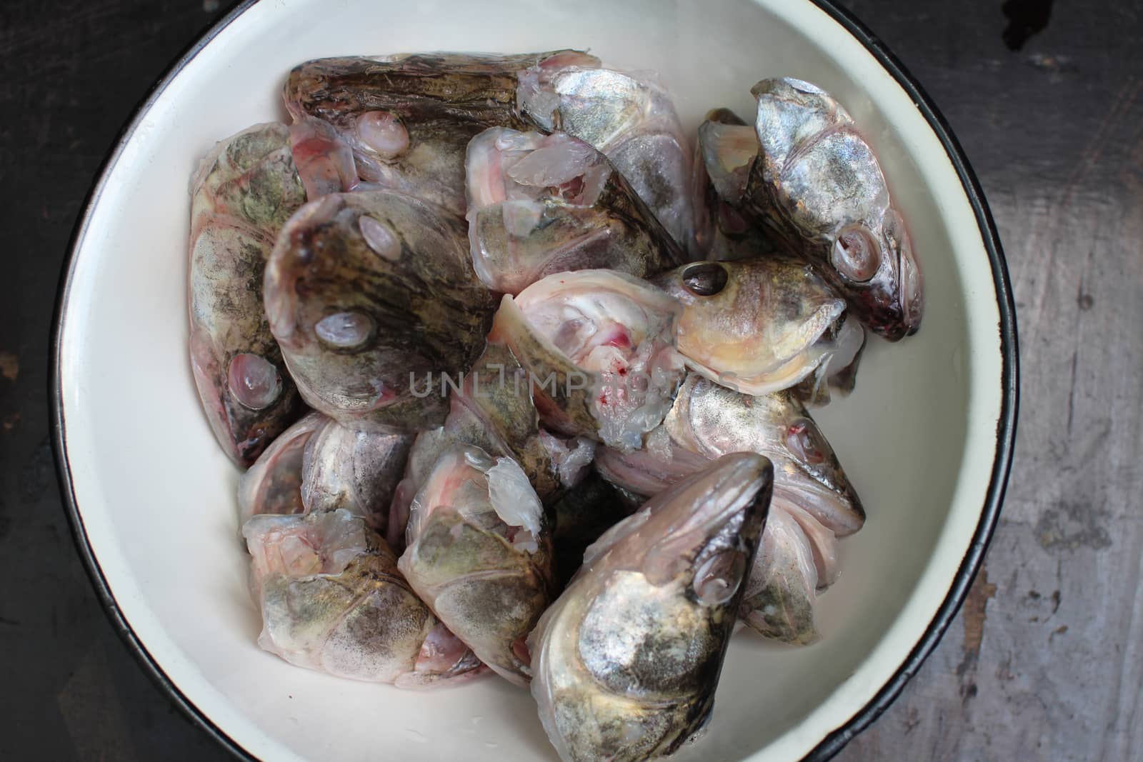 bowl with fish head for cooking fish soup