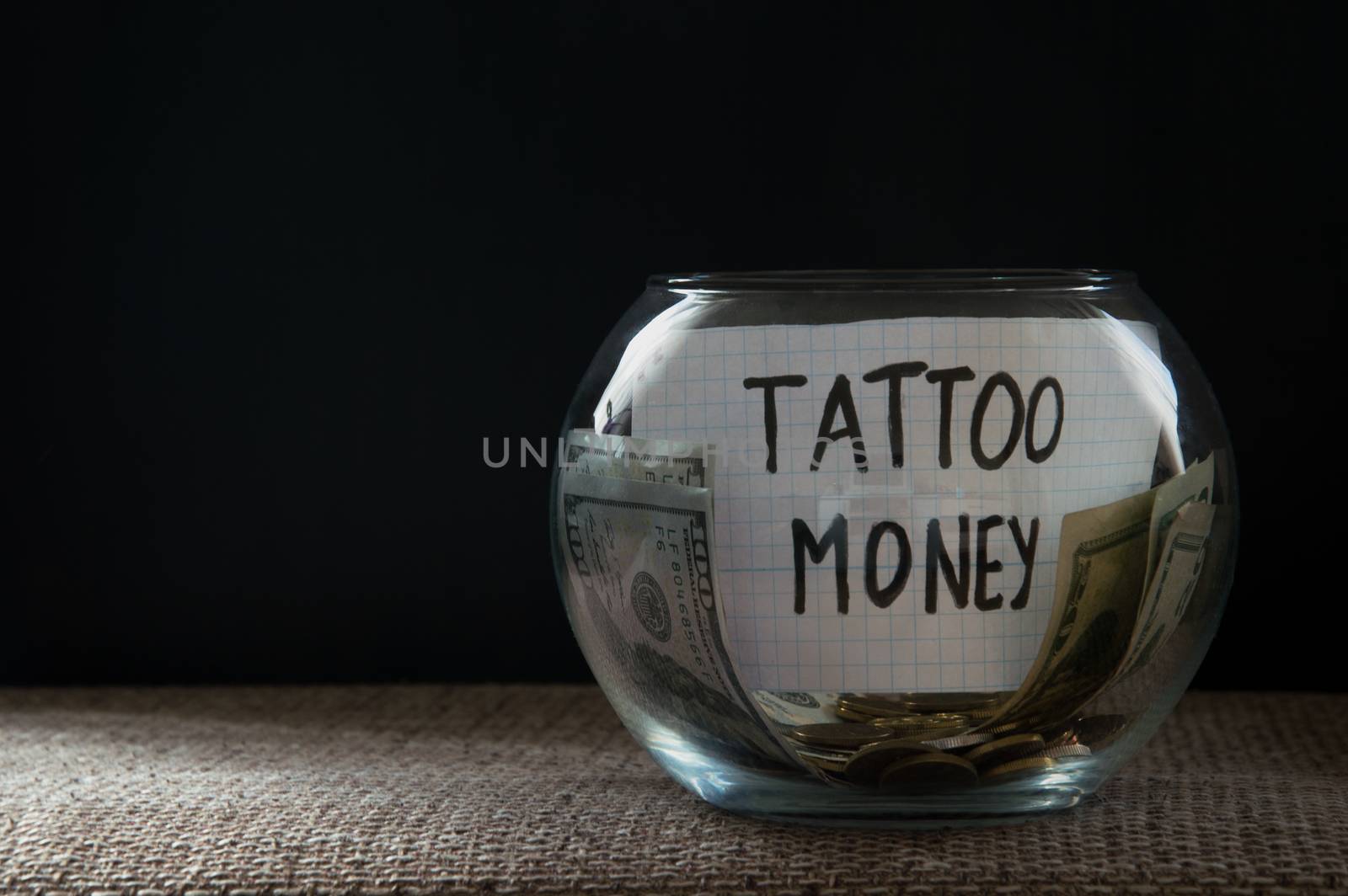 Glass jar witn money for tattoo by natali_brill