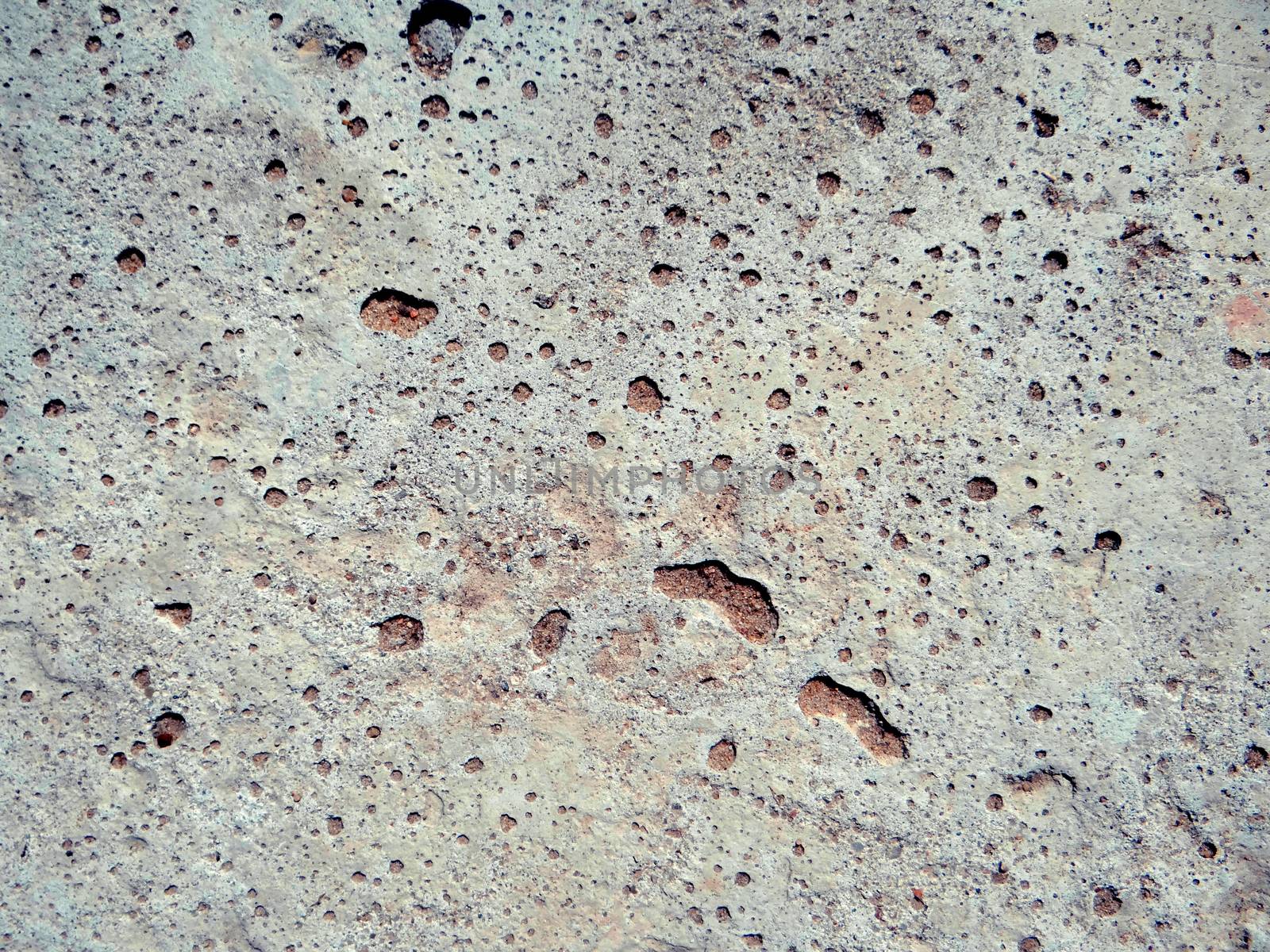 Texture of concrete wall with small holes