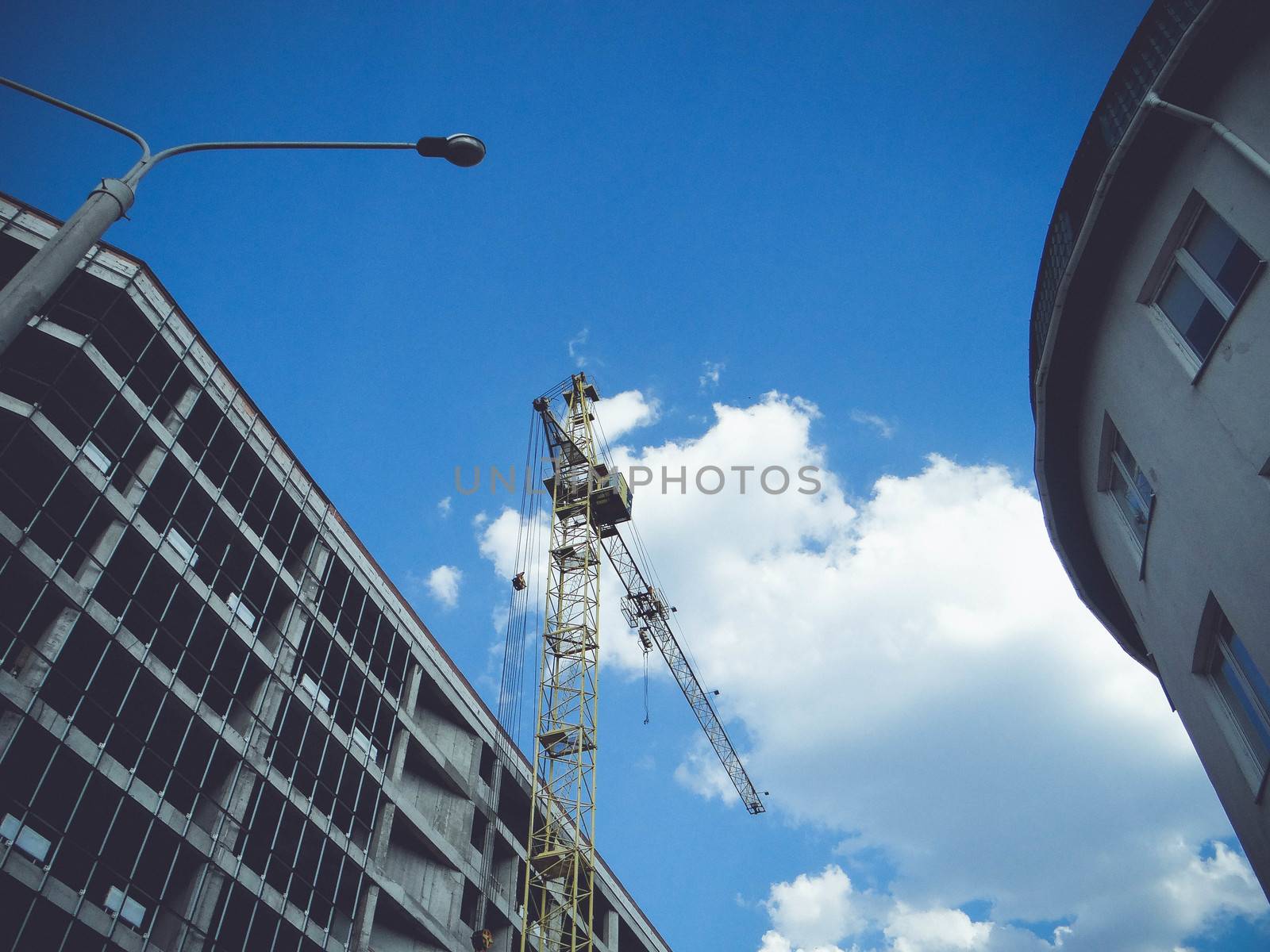 Construction site with cranes by natali_brill
