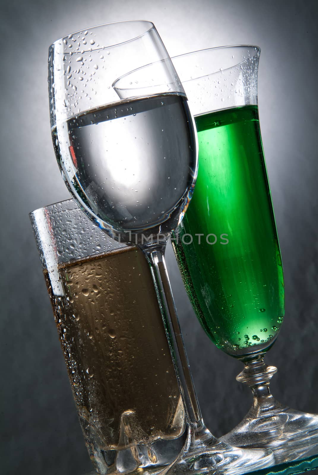 Glasses and beverages on a studio background