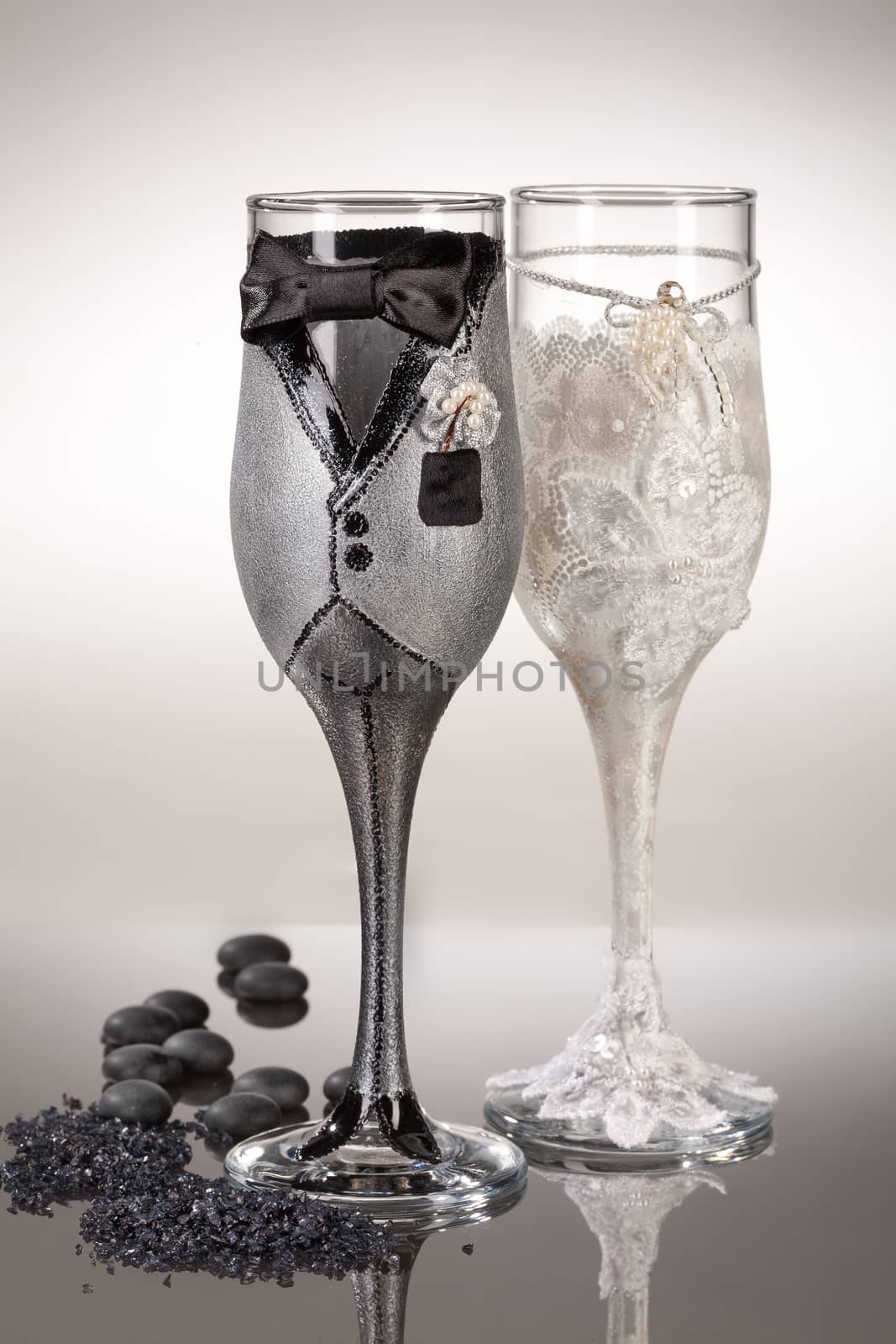 Wineglasses with painting on a glass studio background
