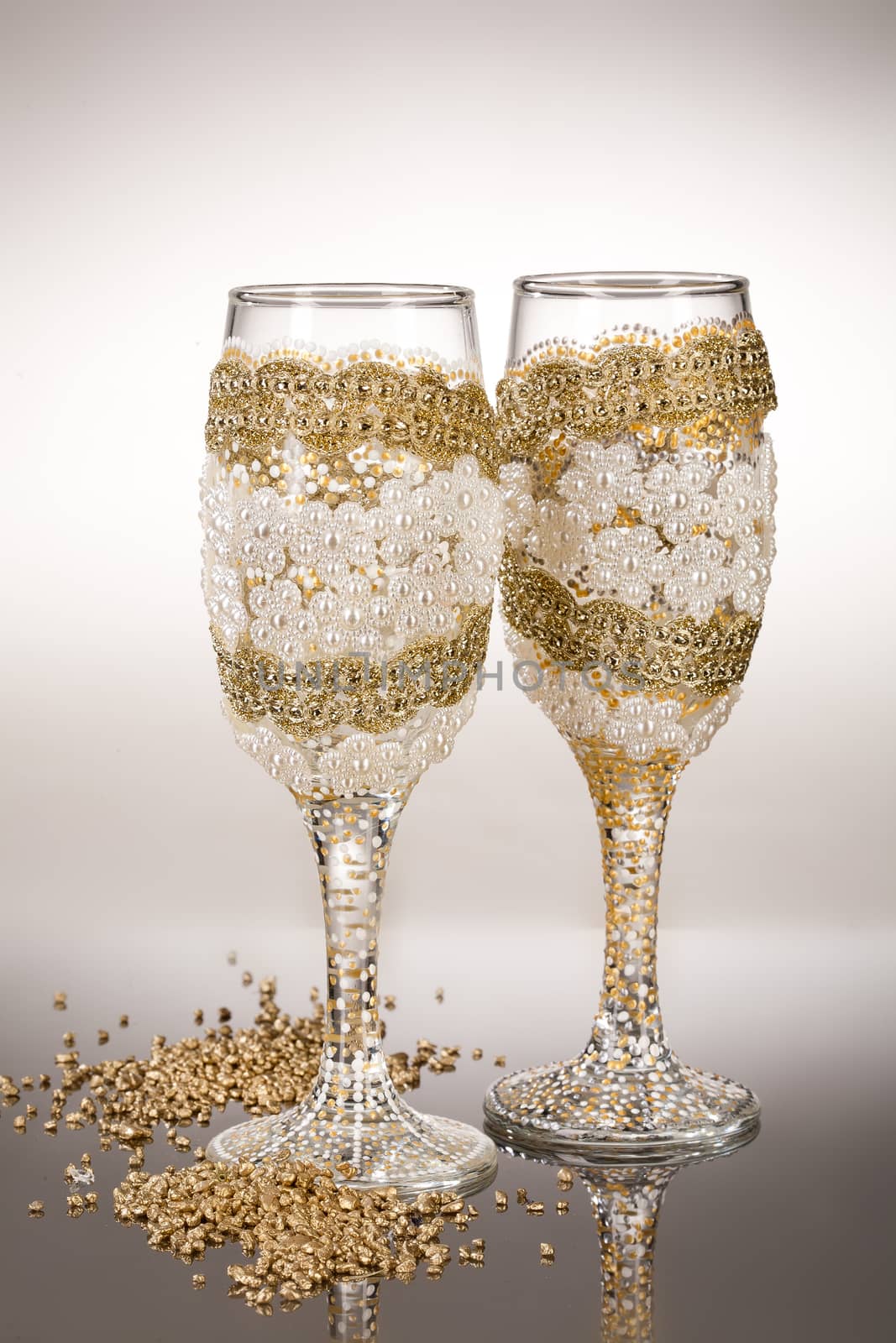 Wineglasses with painting on a glass studio background
