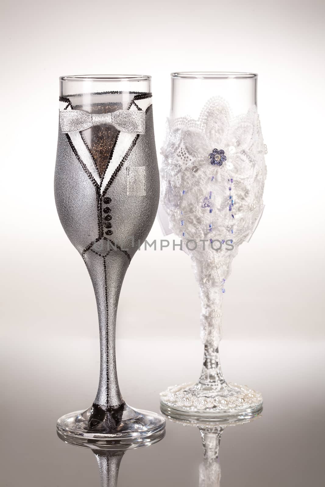 Wineglasses with painting on a glass studio background