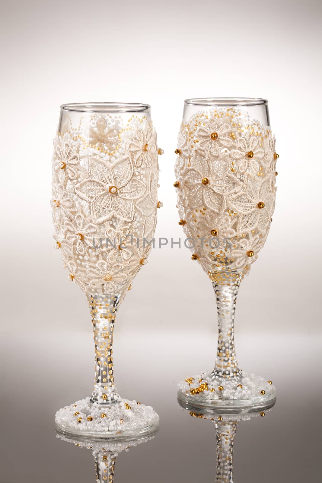 Wineglasses with painting on a glass studio background
