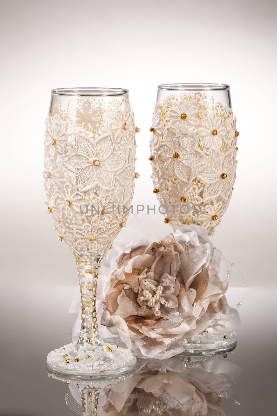 Wineglasses with painting on a glass studio background