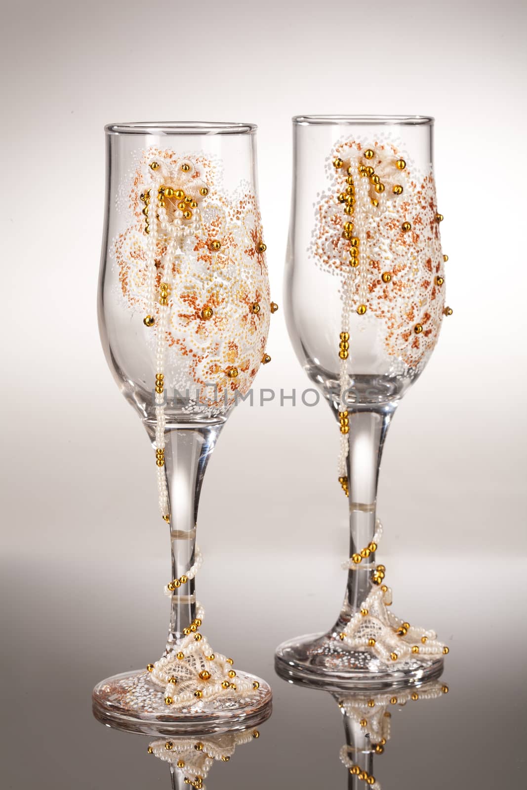 Wineglasses with painting on a glass studio background