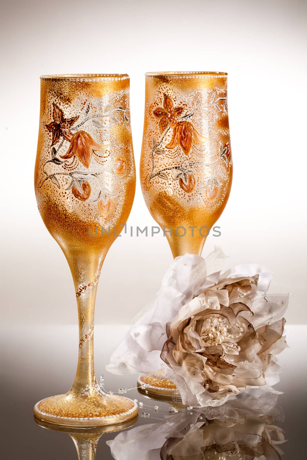 Wineglasses with painting on a glass studio background
