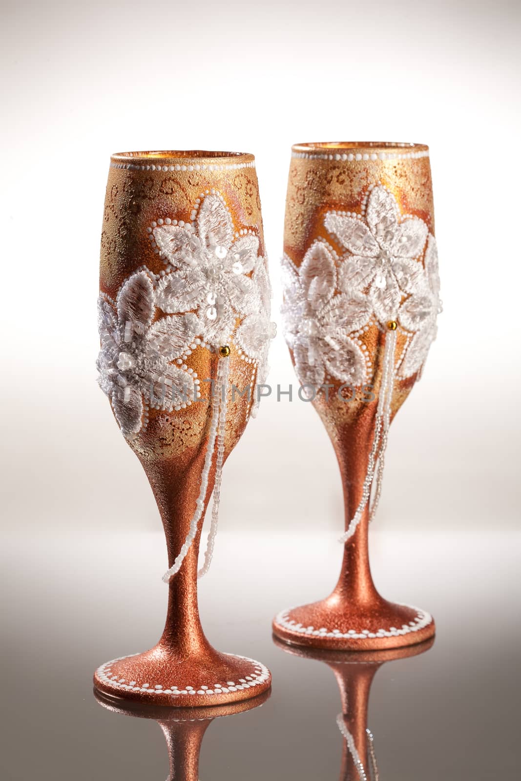 Wineglasses with painting on a glass studio background