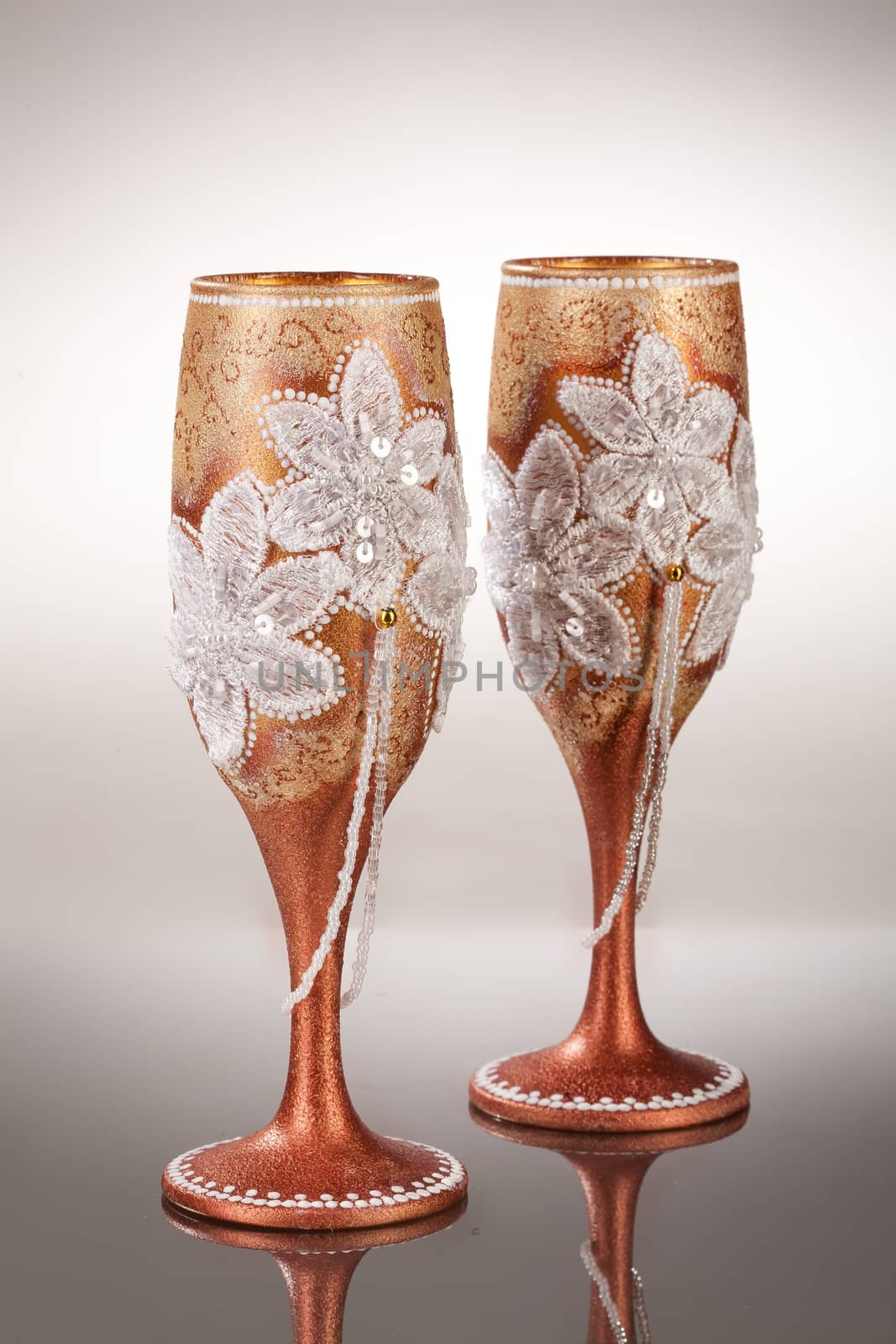 Wineglasses with painting on a glass studio background