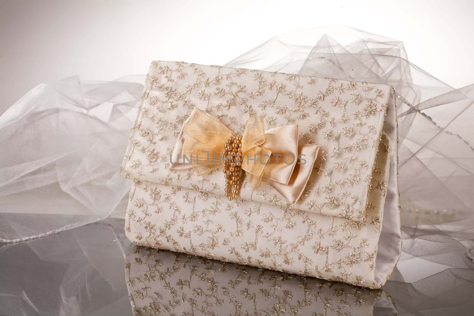 Fabric handmade bag for gift on a glass background