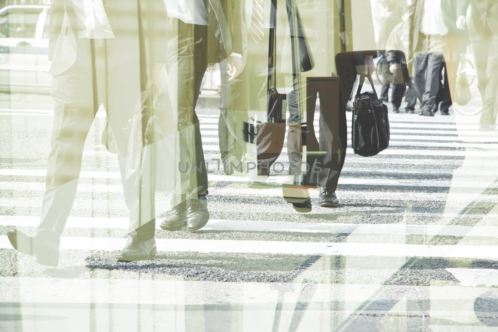 Multiple exposure image of businessman walking