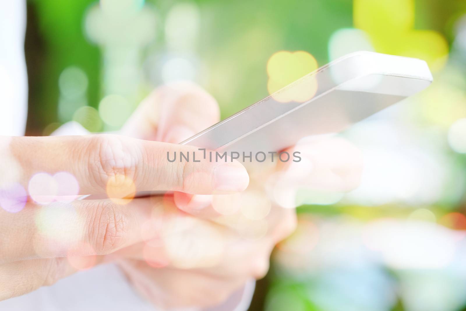 communication technology, close up image of people using smart phone double exposure and blurred view of car on street at night