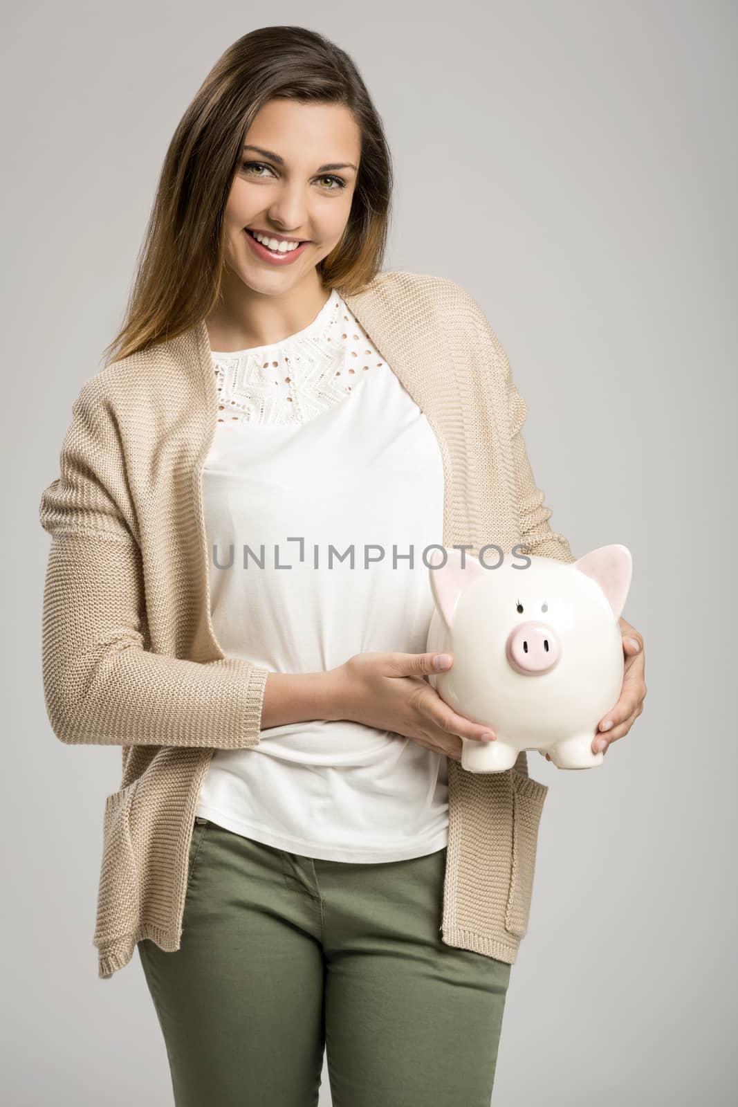 Woman holding piggybank by Iko