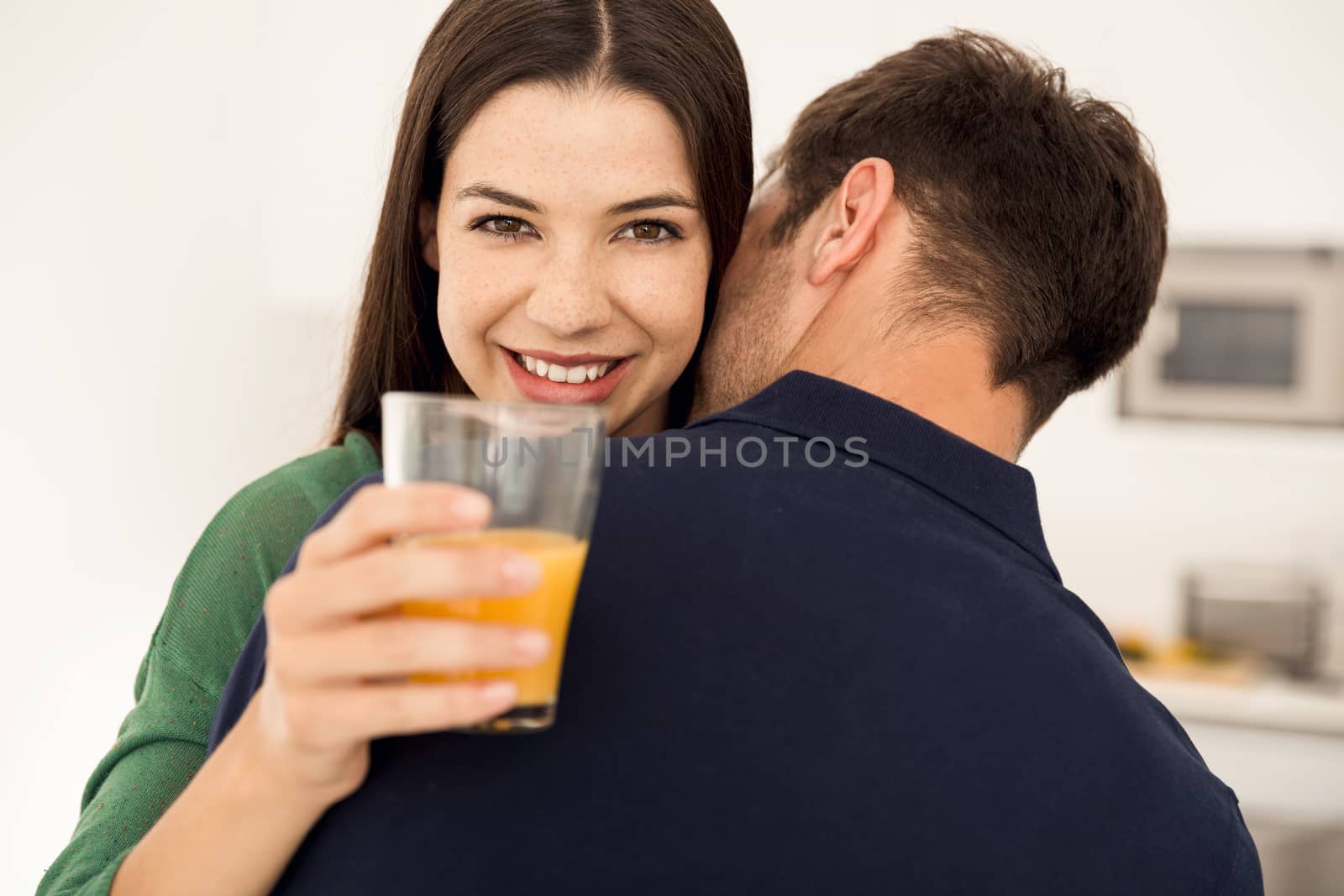 Embraced young couple on the kitchen 