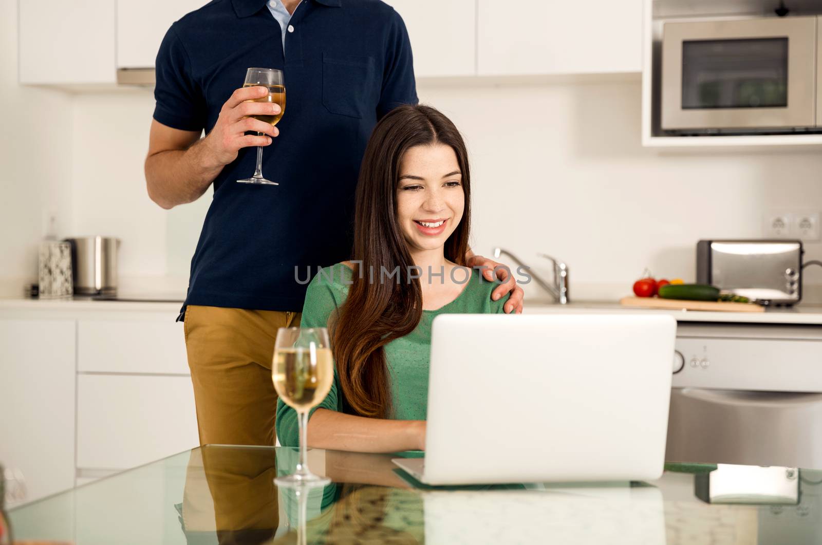 Young couple on the kitchen by Iko