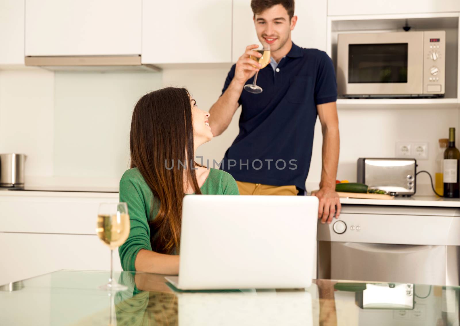Young couple on the kitchen by Iko