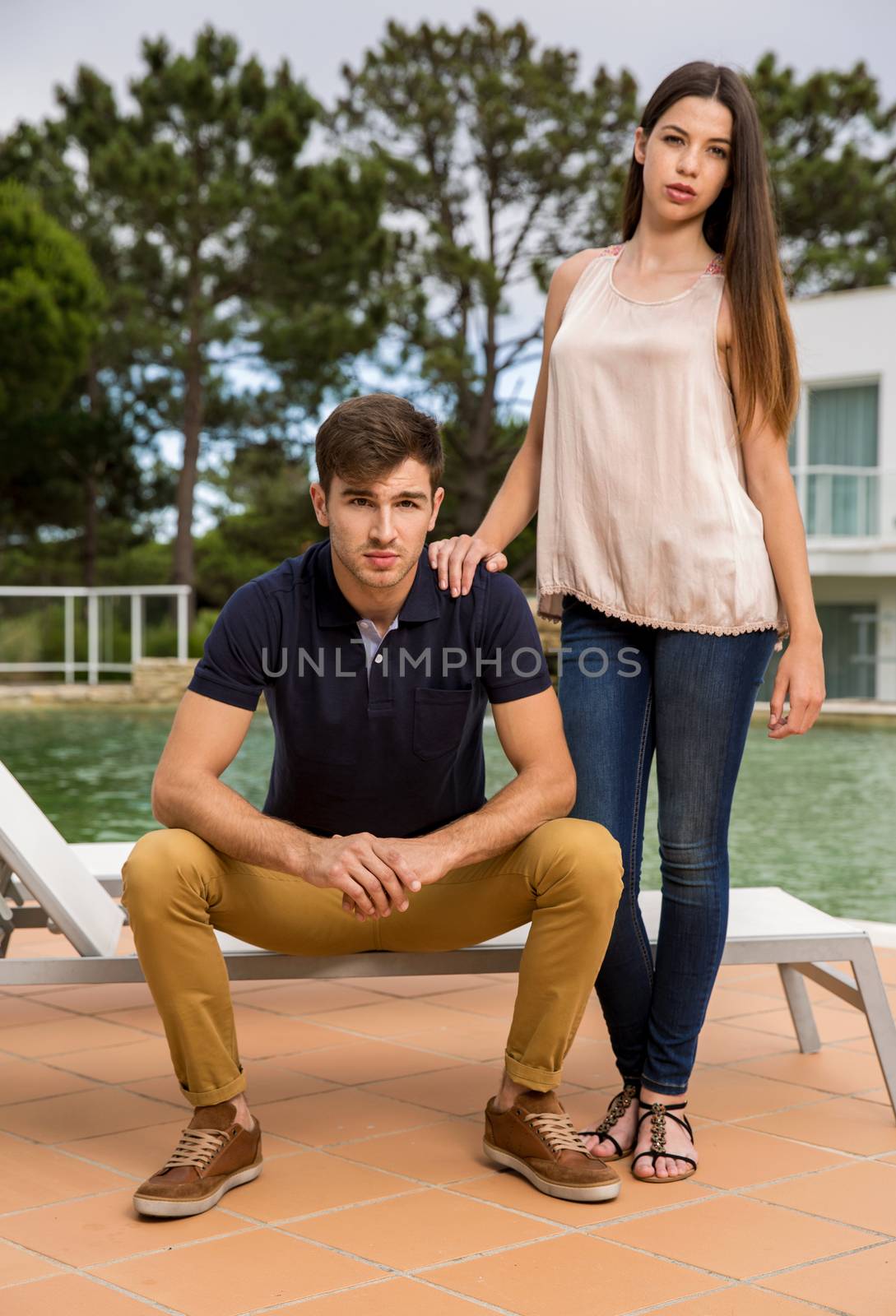 Beautiful young couple posing on a hotel