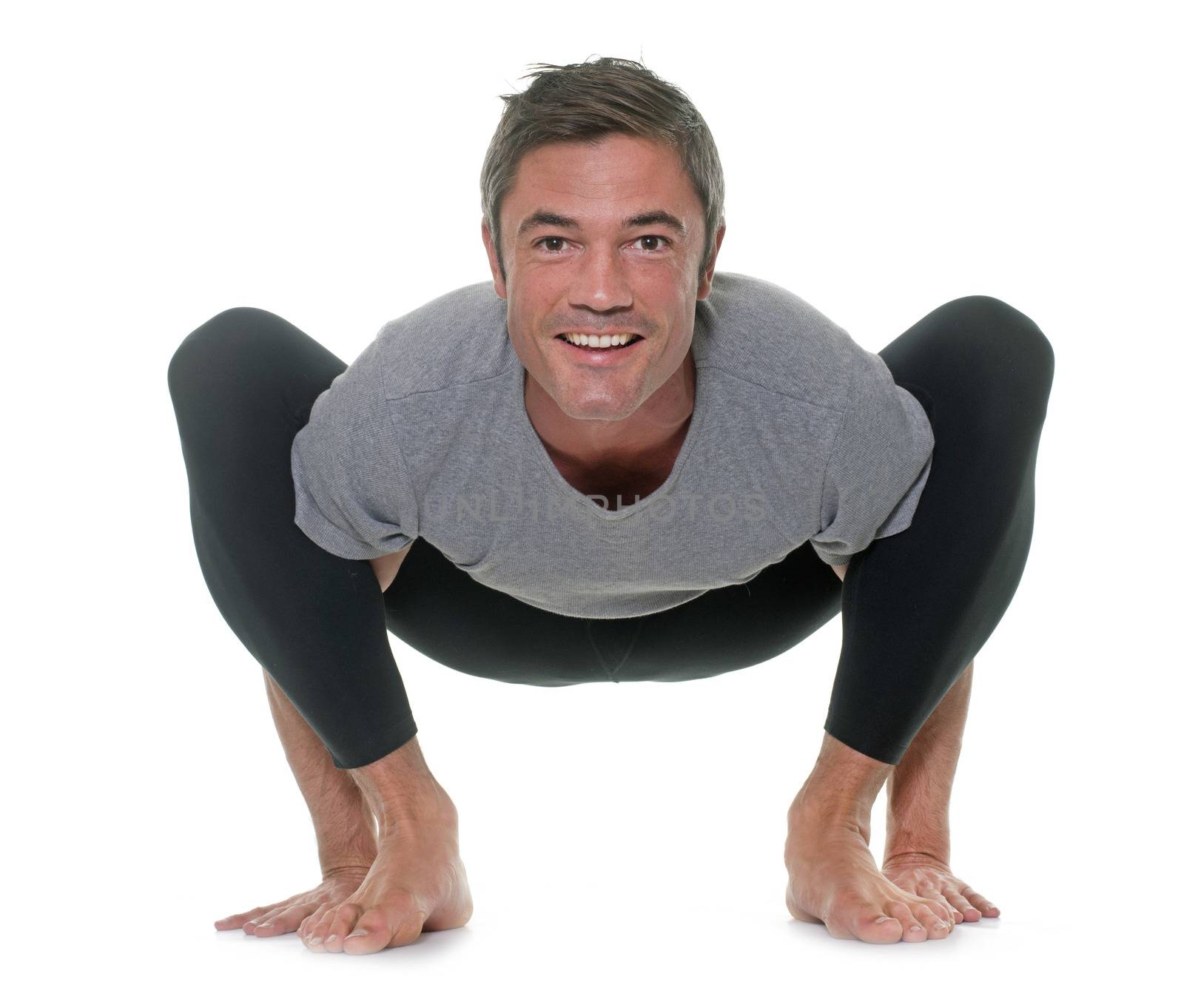 yoga man in front of white background