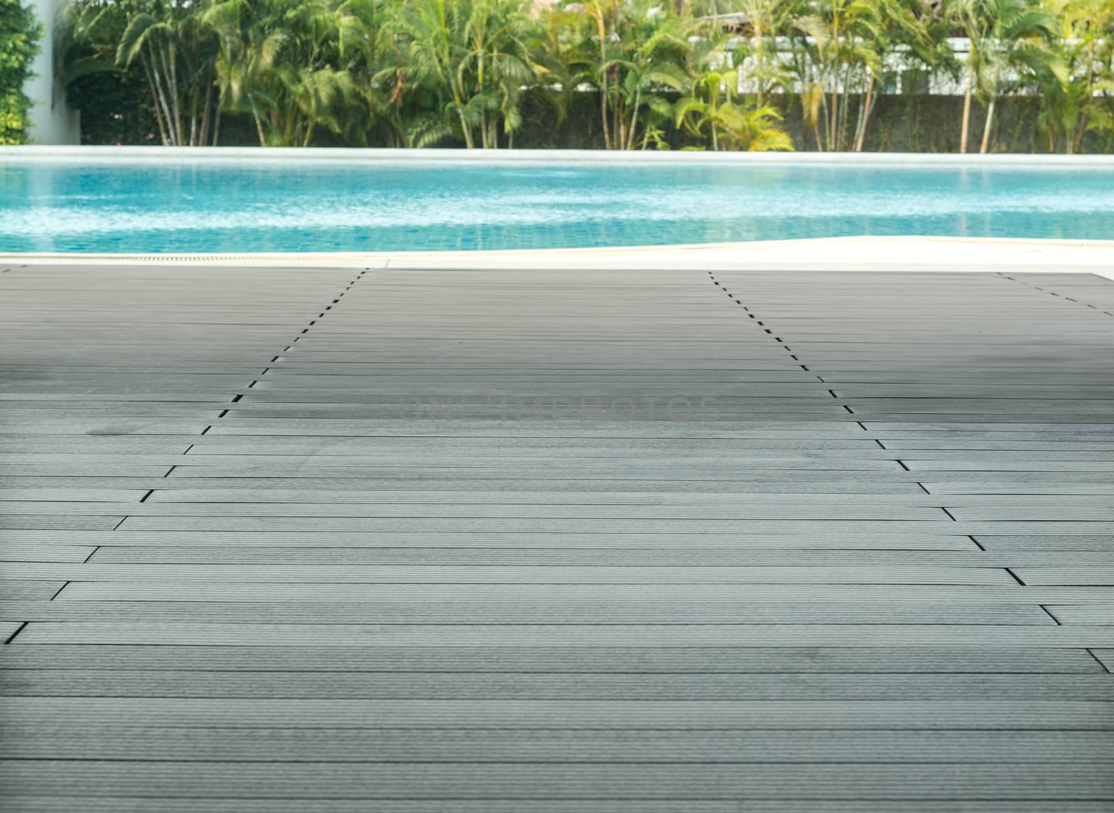 the planking of a swimming pool and it's edge.