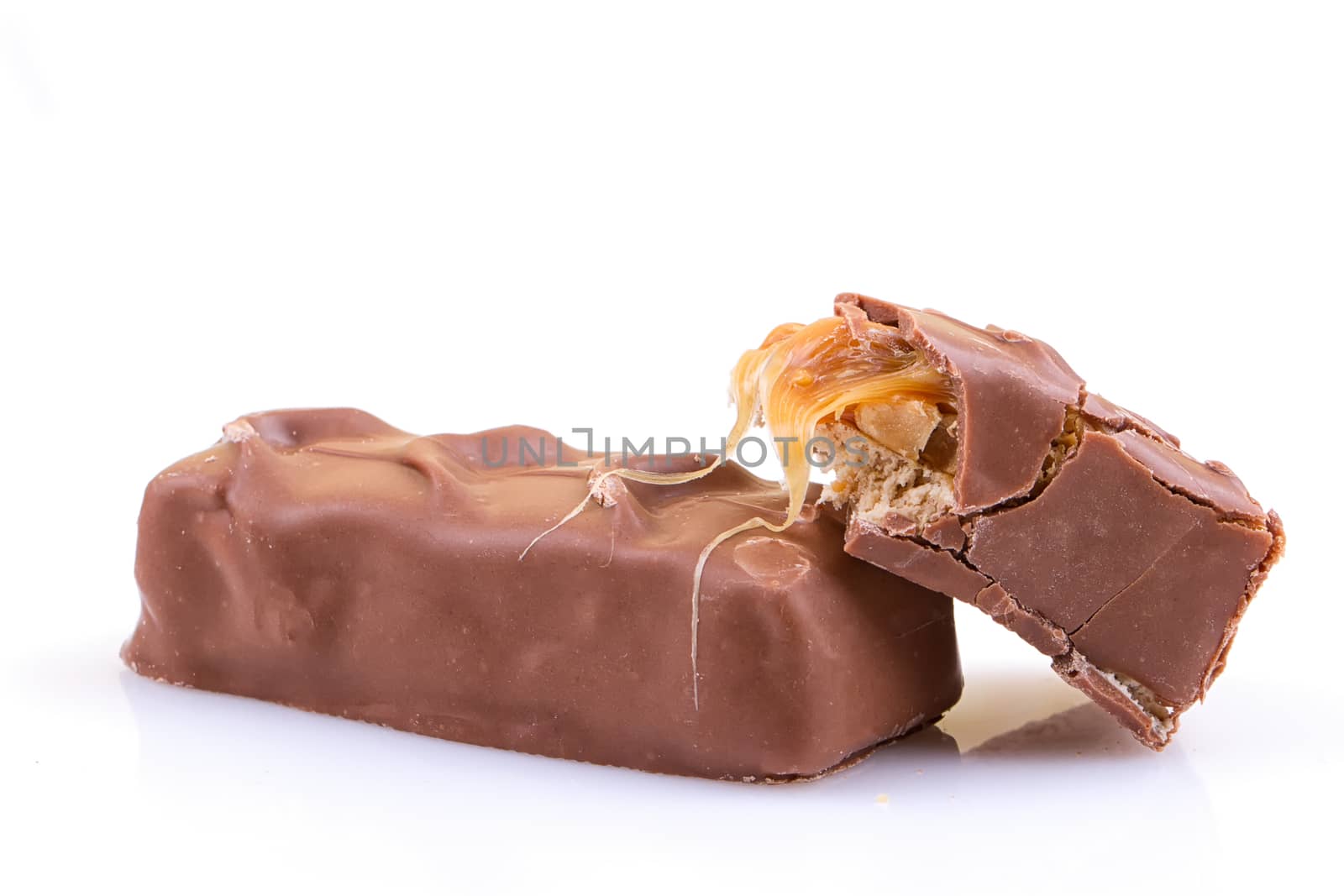 Chocolate bar with caramel isolated on white