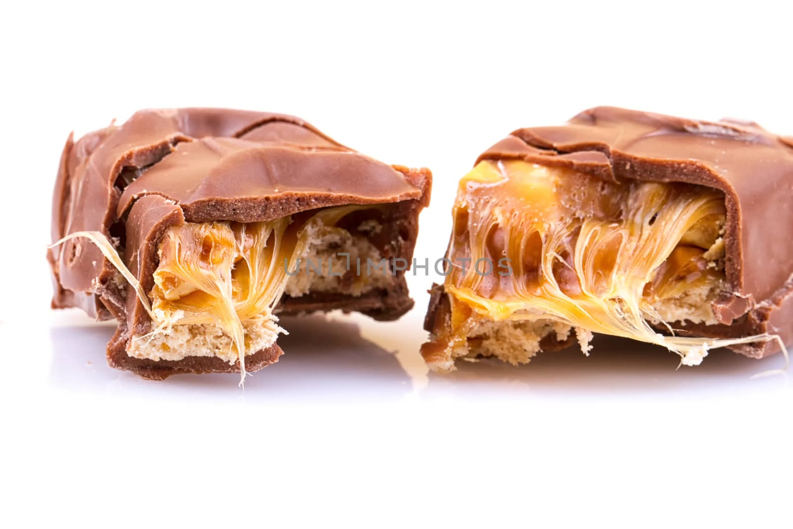 Chocolate bar with caramel isolated on white