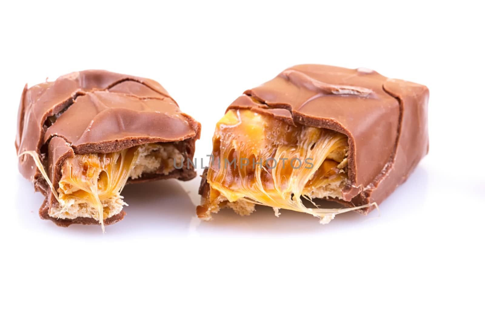 Chocolate bar with caramel isolated on white