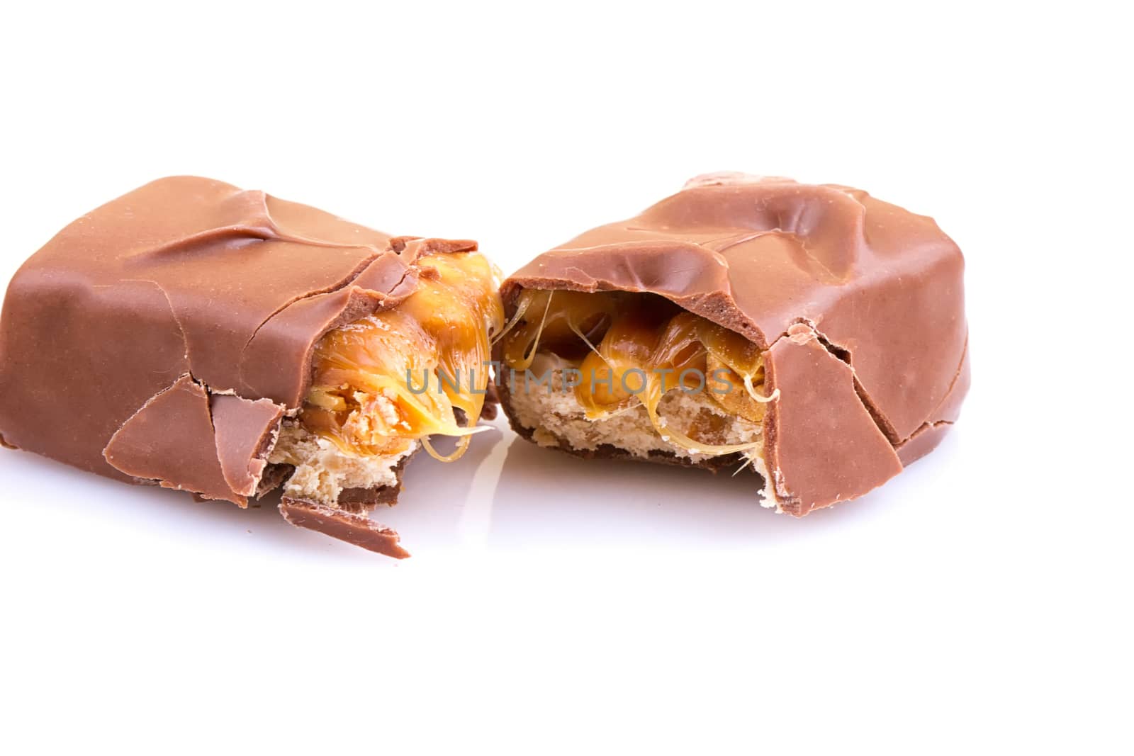 Chocolate bar with caramel isolated on white