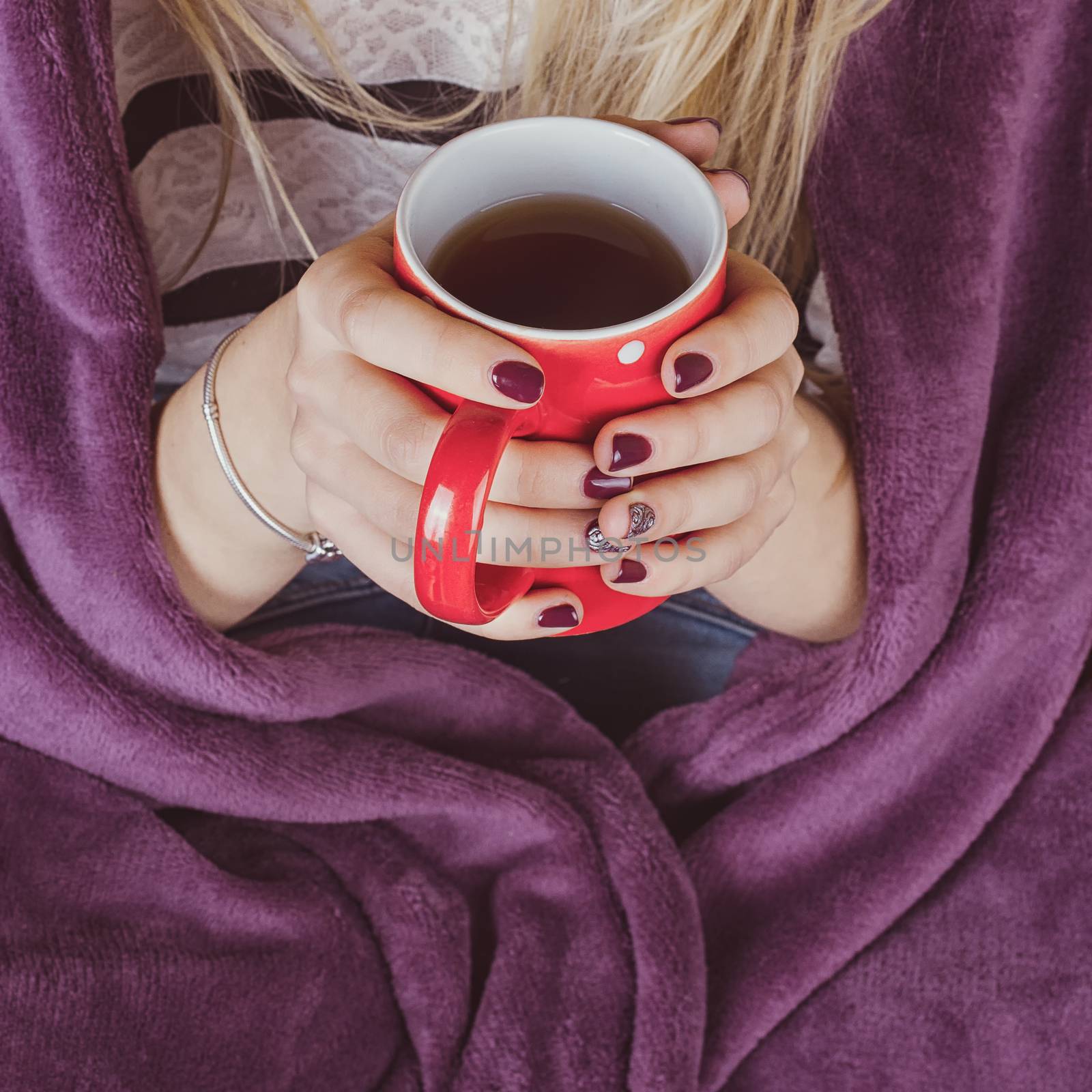 female hands holding mug of hot tea by victosha