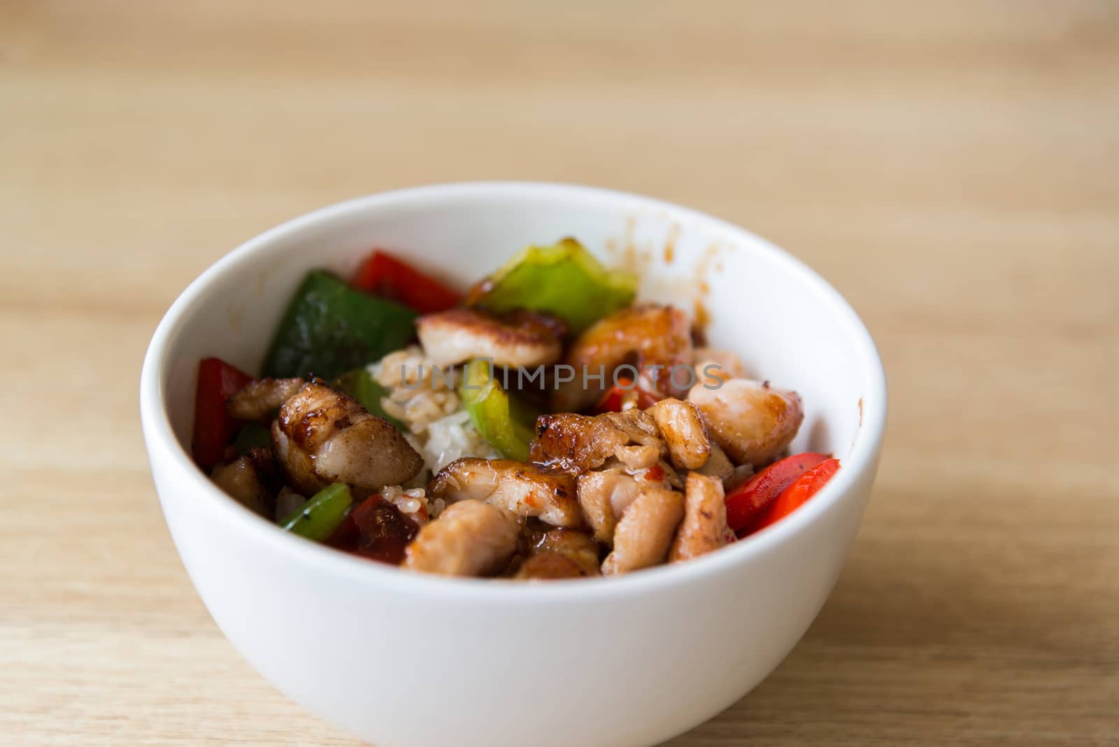 Hot meat salad in white plate by olgavolodina