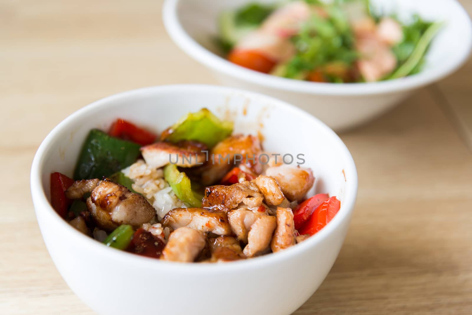 Hot meat salad in white plate by olgavolodina