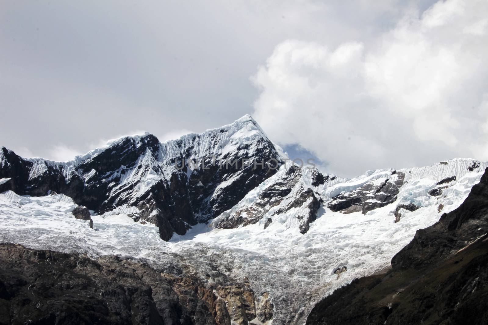 Nice mountain peak with clouds in the peruvian Cordillera Blanca