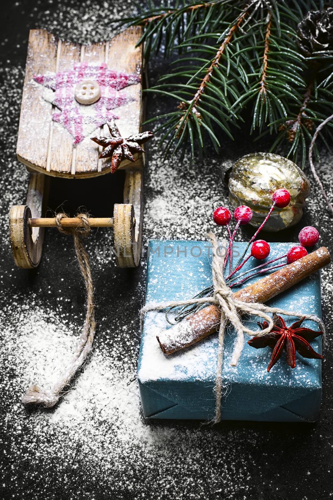 Box with Christmas present and Santa Claus's sledge