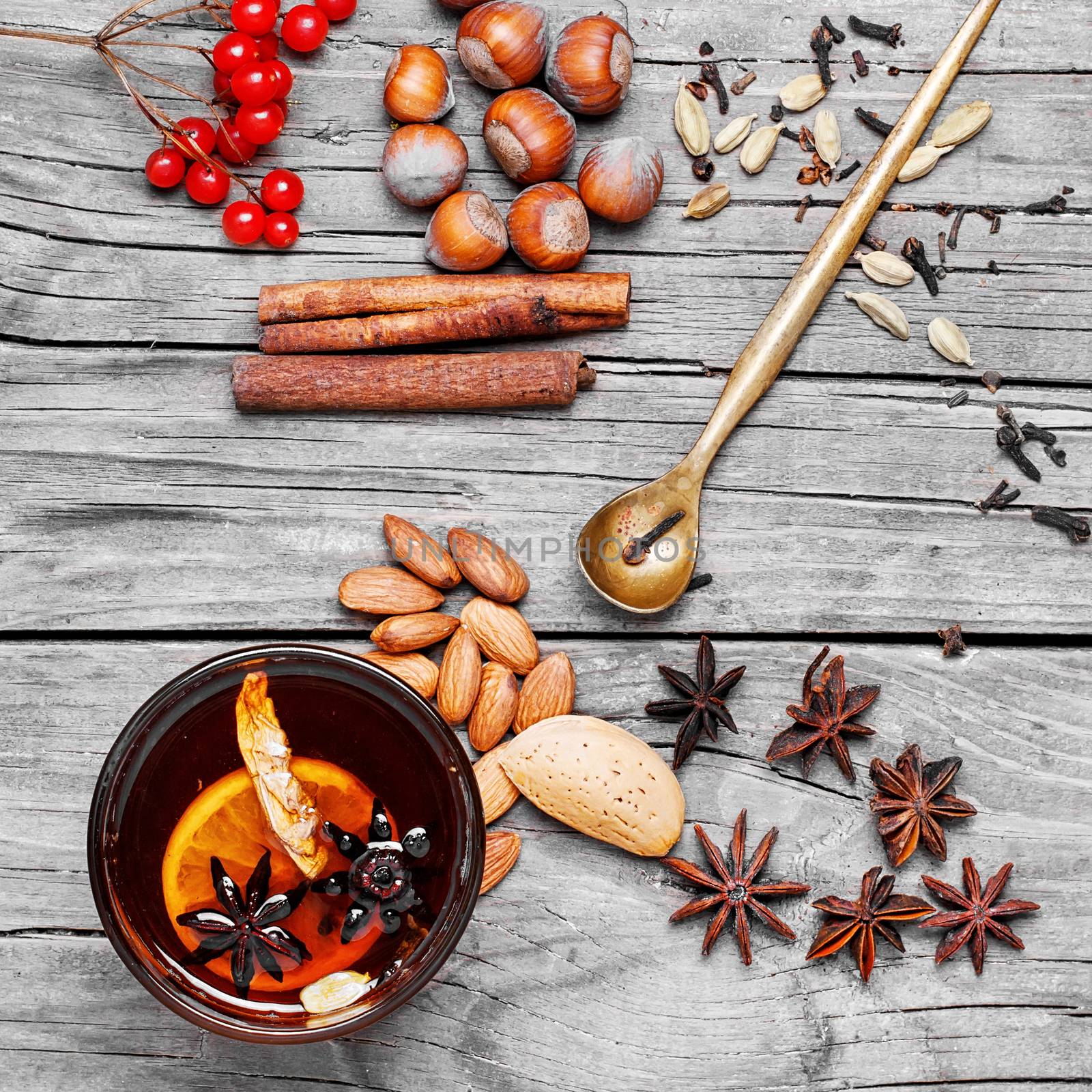 glass of mulled wine and spice rack for beverage