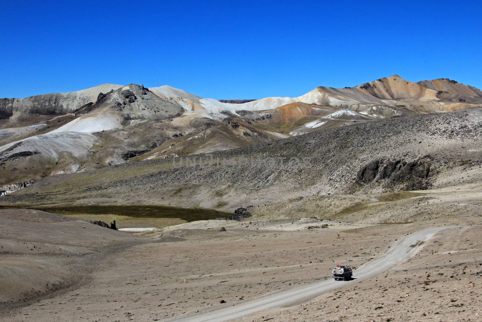 Van cruising an abondend road in the peruvian andes mountains in a very nice moon valley