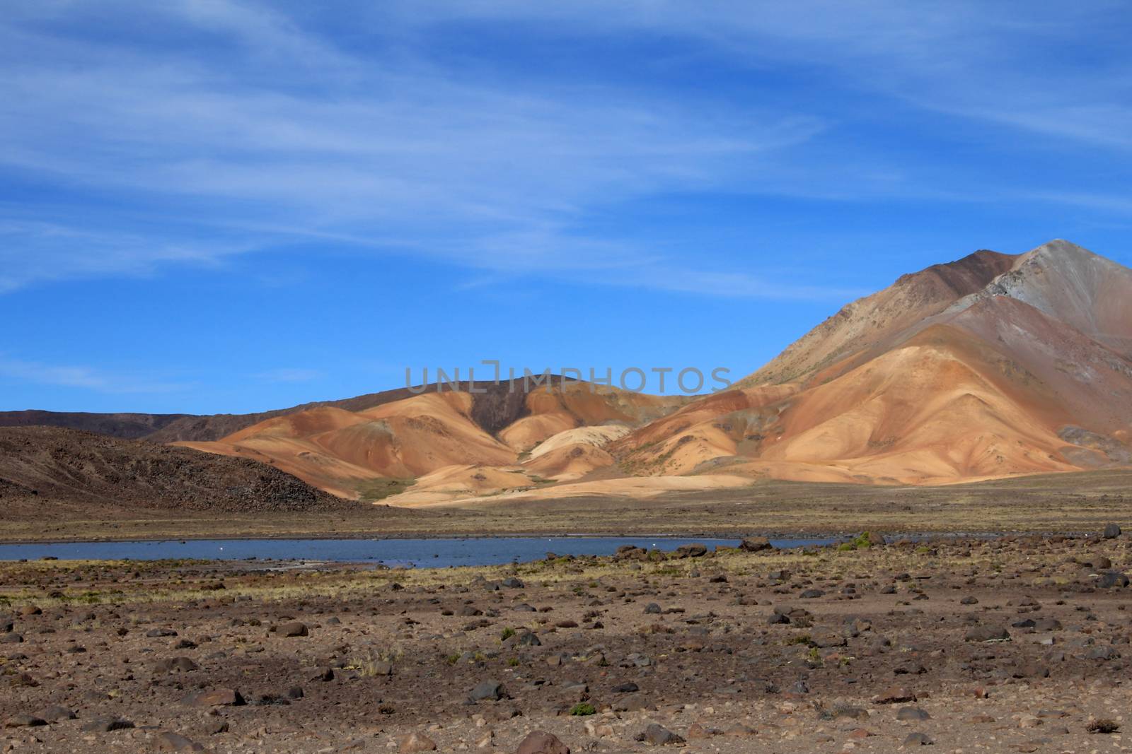 The colorful mountains and a nice lake in the peruvian andes on the way to Colca canyon